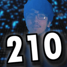 a man with glasses and the number 210 in white letters
