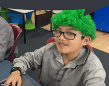 a young boy wearing a green wig and glasses is smiling