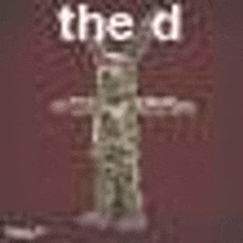 a picture of a cross with the words `` the d '' on it .