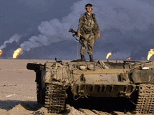 a soldier is standing on top of a tank with the letters aavv on the side