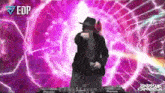 a man in a hat is dancing in front of a purple background with edp written on it