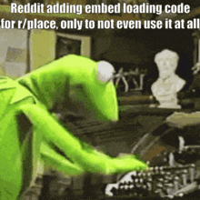 kermit the frog is typing on a keyboard with a caption that says reddit adding embed loading code