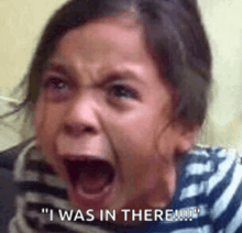 a little girl is crying with her mouth open and the words `` i was in there '' written on the bottom .