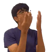 a man wearing glasses is clapping his hands