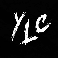 the letter y is written in white on a black background with a brush stroke .