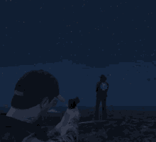 a man in a baseball cap holds a gun in front of a night sky