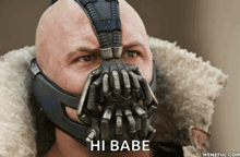 a bald man wearing a mask with the words hi babe on it