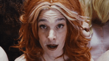 a close up of a woman with red hair