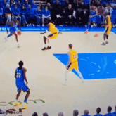 a basketball game is being played with a player wearing the number 22 on his back