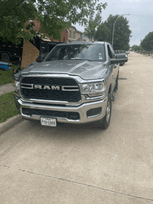 a silver ram truck has a texas license plate