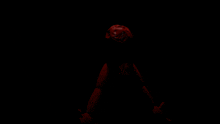 a red figure in a dark room with the letter a on its chest