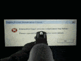 a person is holding a gun in front of a logon process initialization failure screen