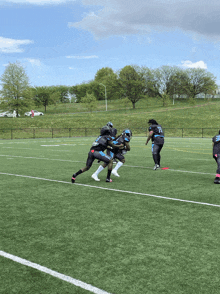 a group of football players on a field one of whom is wearing a jersey with the number 23 on it