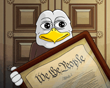 an eagle is holding a framed copy of the we the people