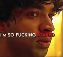 a close up of a man 's face with the words " i 'm so fucking scared " above him