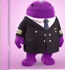 a purple stuffed animal is wearing a pilot 's suit and tie .