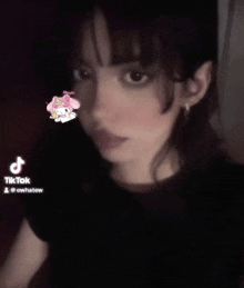 a tiktok video of a girl with a my melody sticker