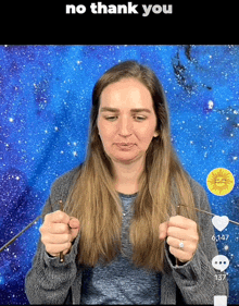 a woman is holding a pair of knitting needles in front of a blue background with the words " no thank you "