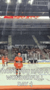 a hockey player stands on the ice in front of a crowd and says hope you had a wonderful day