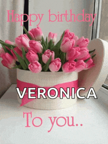 a birthday card for veronica with a heart shaped box of pink flowers