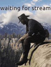 a man in a cowboy hat sits on the edge of a cliff with the words waiting for stream above him