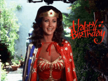 a woman in a wonder woman costume says happy birthday in red