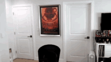 a room with a chair and a poster on the wall that says ' apocalypse ' on it