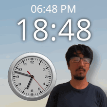 a man with glasses stands in front of a clock that says 18:48