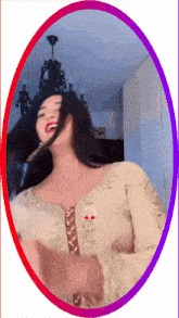 a woman in a gold dress is dancing in front of a purple and red border