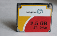 a seagate 2.5 gb st1 drive sits on a white table