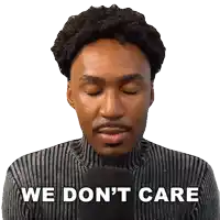 a man with his eyes closed is holding a microphone and says we don t care