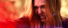 scarlet witch is crying in a close up of her face .