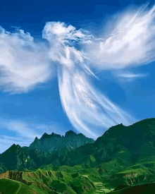 a cloud that looks like an angel is floating over a mountain range