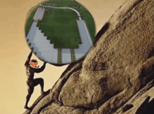 a statue of a man carrying a large rock up a hill