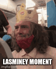 a man wearing a burger king crown and a red bandana says lasminey moment .