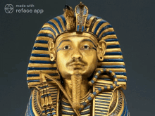 a statue of a pharaoh with a reface app logo behind it