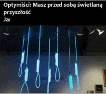 a bunch of hangers hanging from the ceiling with a caption in polish