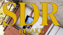 a man laying on the ground with the words sdr by zakg on the bottom