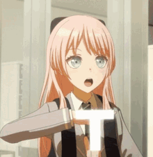a girl with long pink hair and blue eyes is holding a white t in her hand .