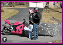 a man and woman standing next to a pink and black motorcycle