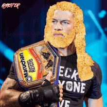 a man with a beard is holding a maruchan ramen reigns championship belt