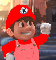 a cartoon character wearing a red hat and overalls with a k on it