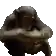 a pixel art of a chimpanzee sitting on a wooden plank .