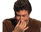 a man in a brown jacket is laughing with his hand on his face .