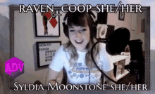 a woman is wearing headphones and smiling in front of a microphone with the words raven coop she her syldia moonstone she her