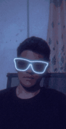 a man wearing a pair of neon sunglasses looks at the camera