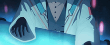 a person in a suit is holding a blue object in their hands