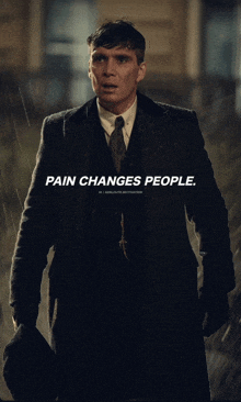 a man in a suit and tie stands in the rain with the words pain changes people