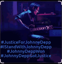 a picture of a man playing a guitar with the words justice for johnny depp on the bottom