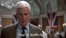 a man in a suit and tie is saying " you 're both right "